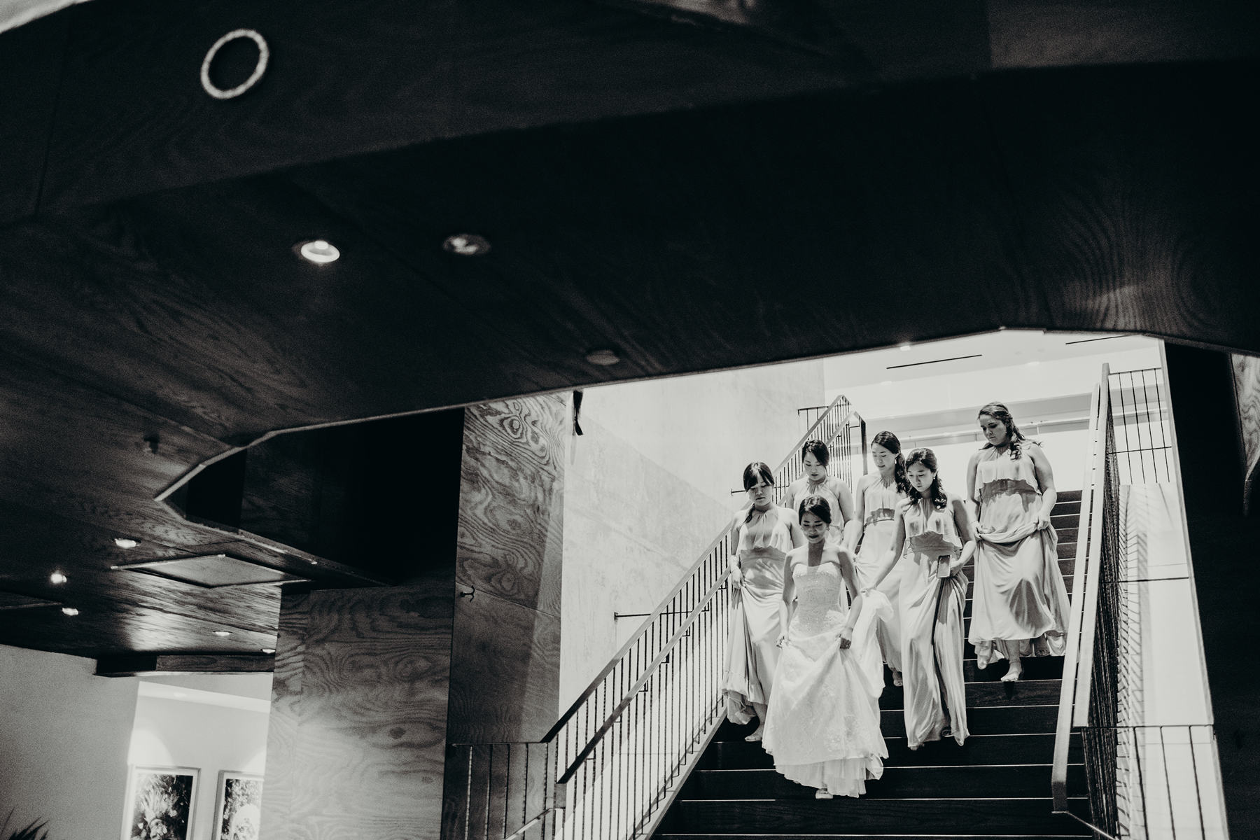 Picture of bride coming down from the stairs with other women