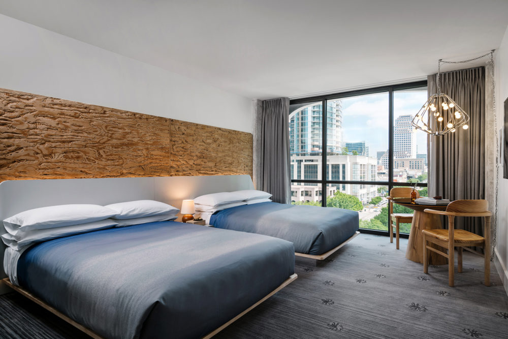 Room with two bed and a transparent window