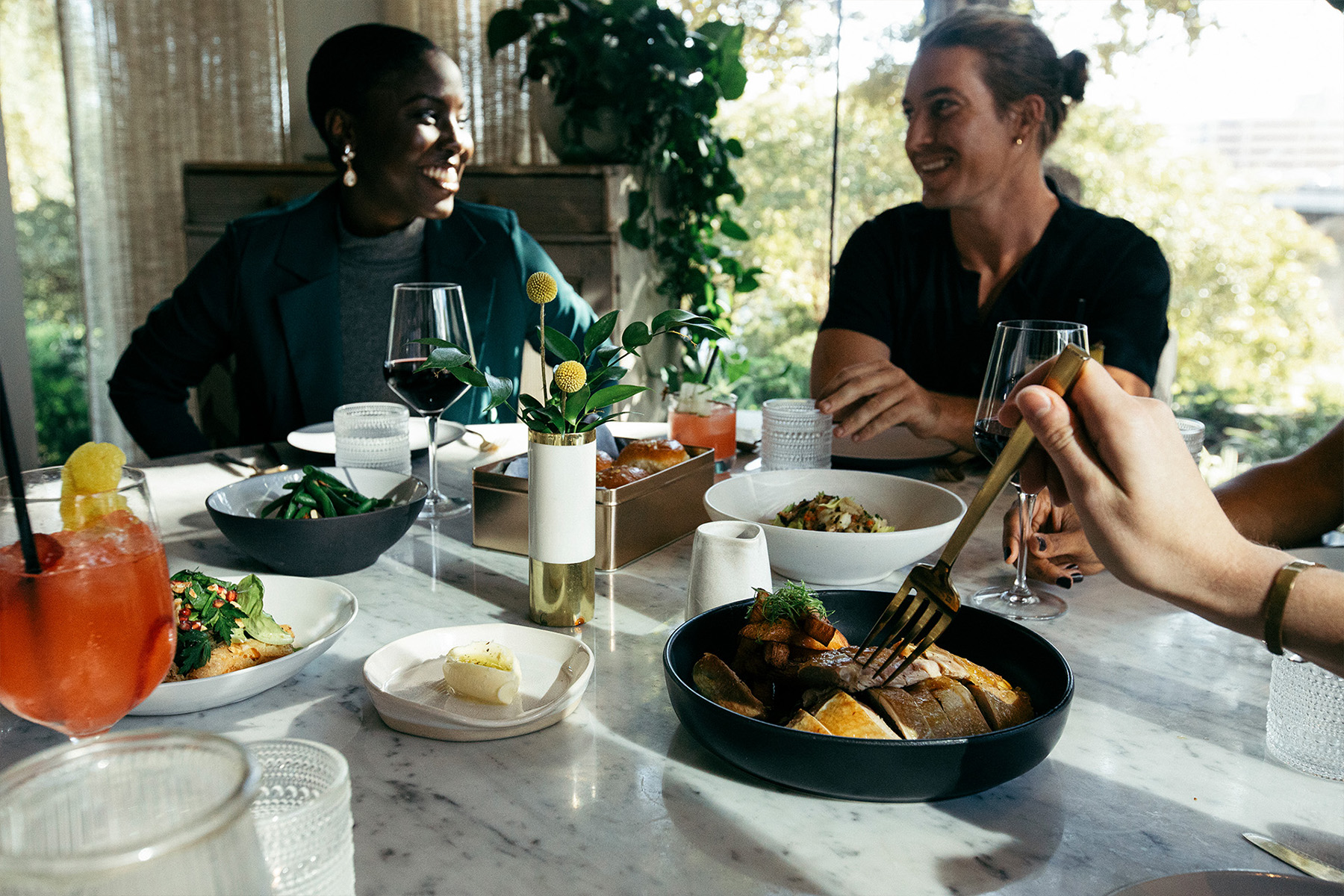 People eating from the dining table