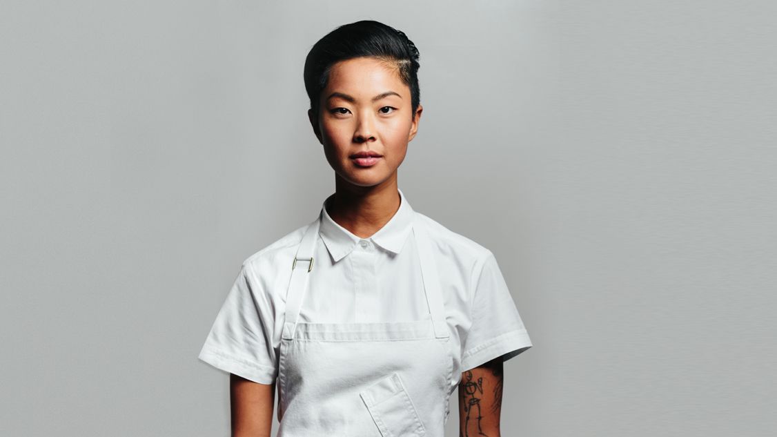 Woman with short hair wearing white dress