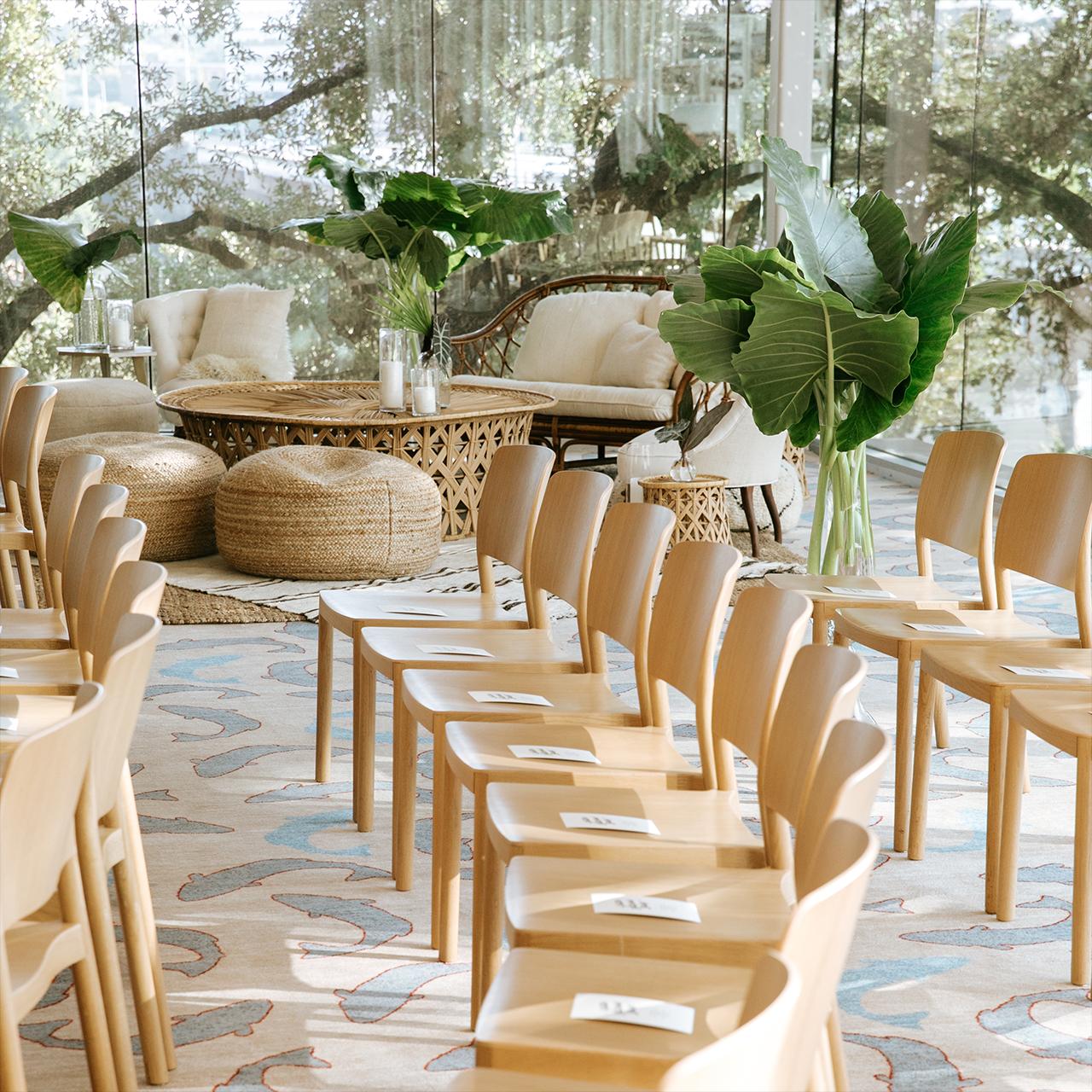 Wooden chairs in rows prepared for a wedding