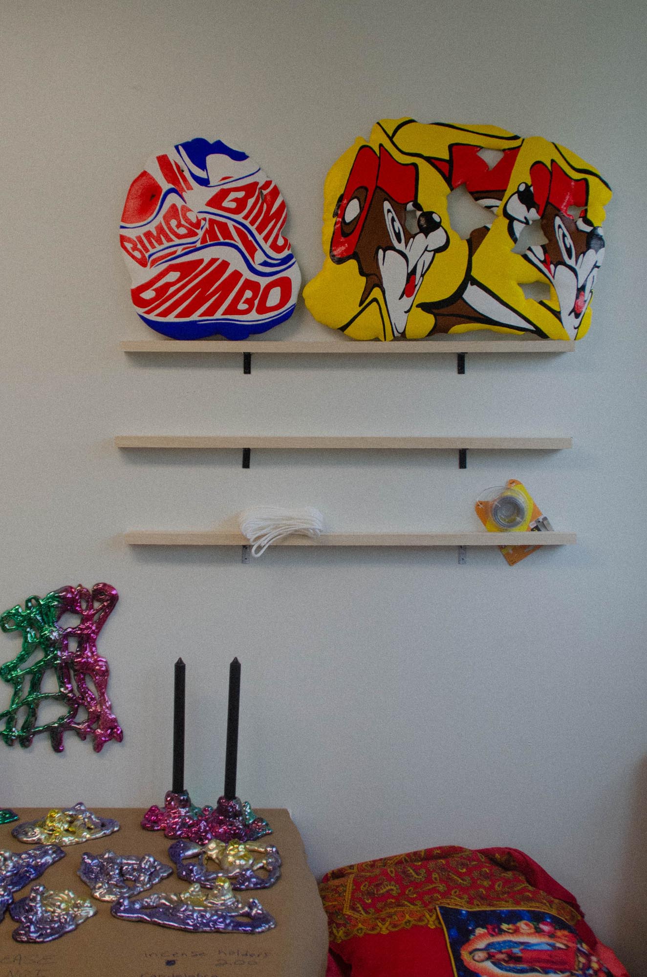 a table with 2 black candles