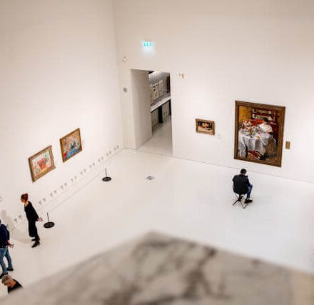 People viewing artwork in a modern museum gallery