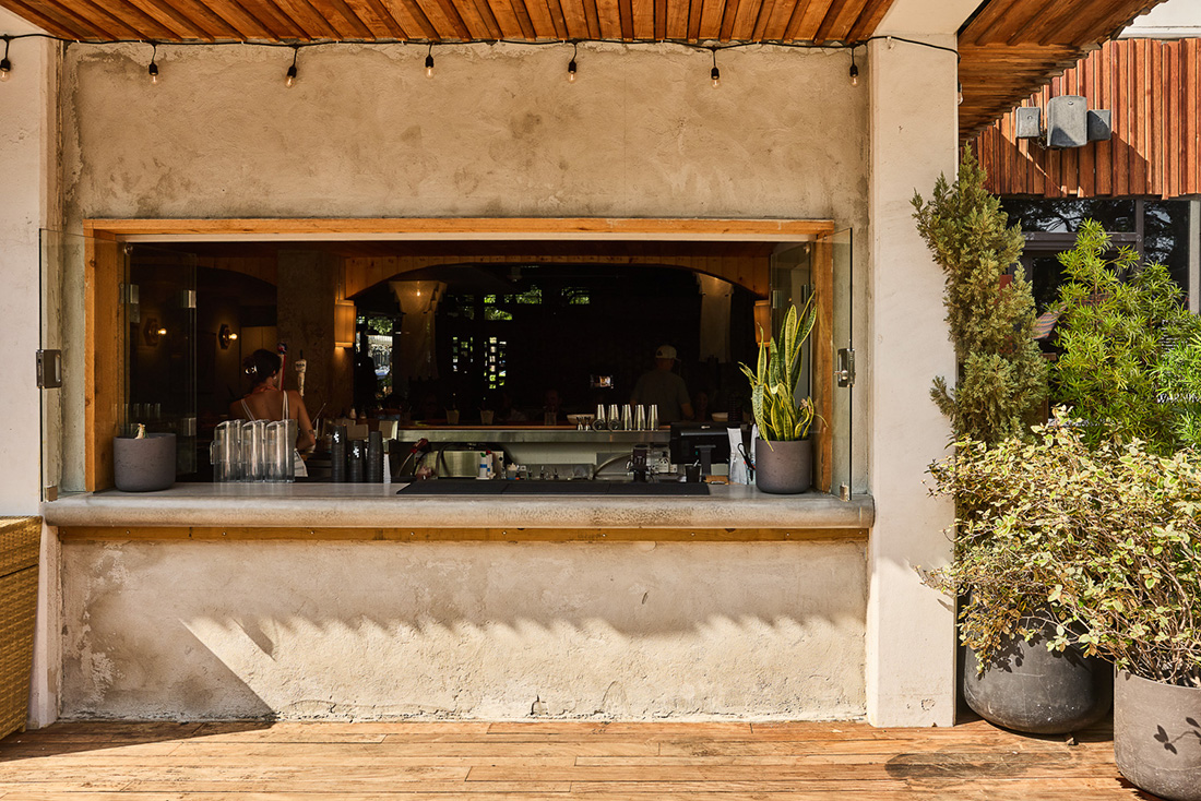 Poolside view into the bar window of Cantero at the LINE Austin