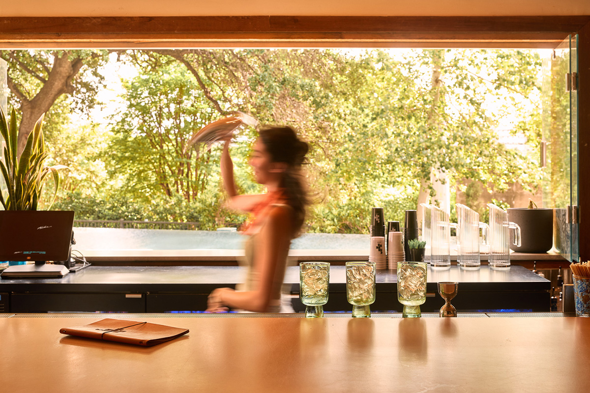 Bartender making a drink in Cantero cocktail bar at the LINE Austin
