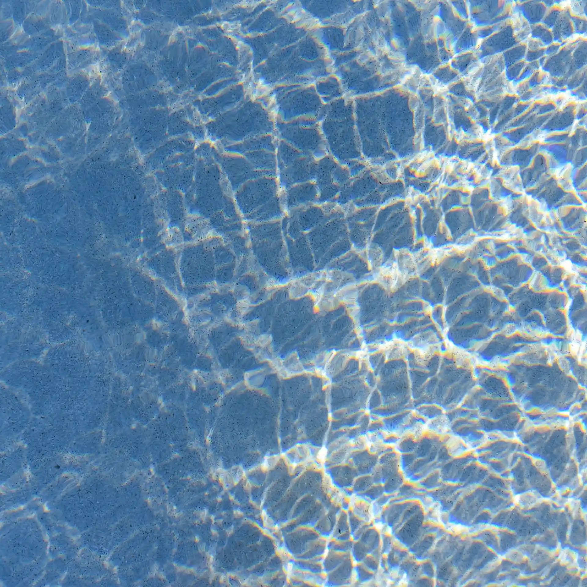 Blue water and pouring mica through a layer of glitter water.