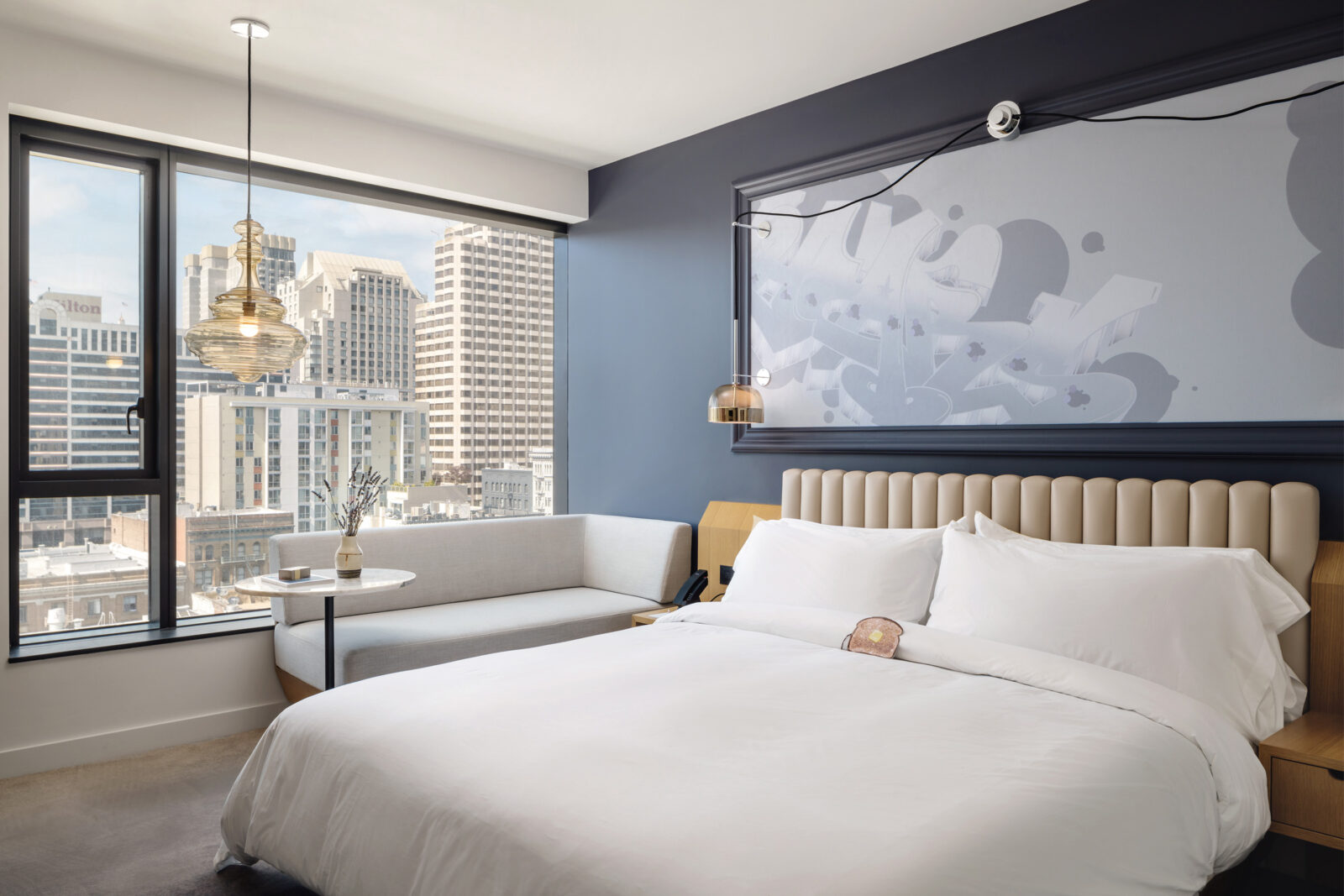 King bed with skyline views of San Francisco