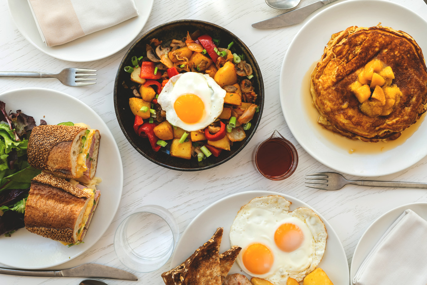 A table filled with various breakfast dishes