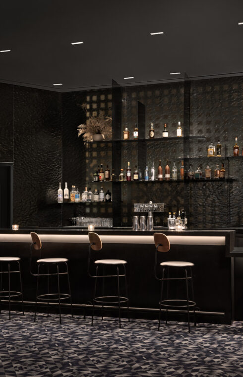 A dark grey cocktail bar