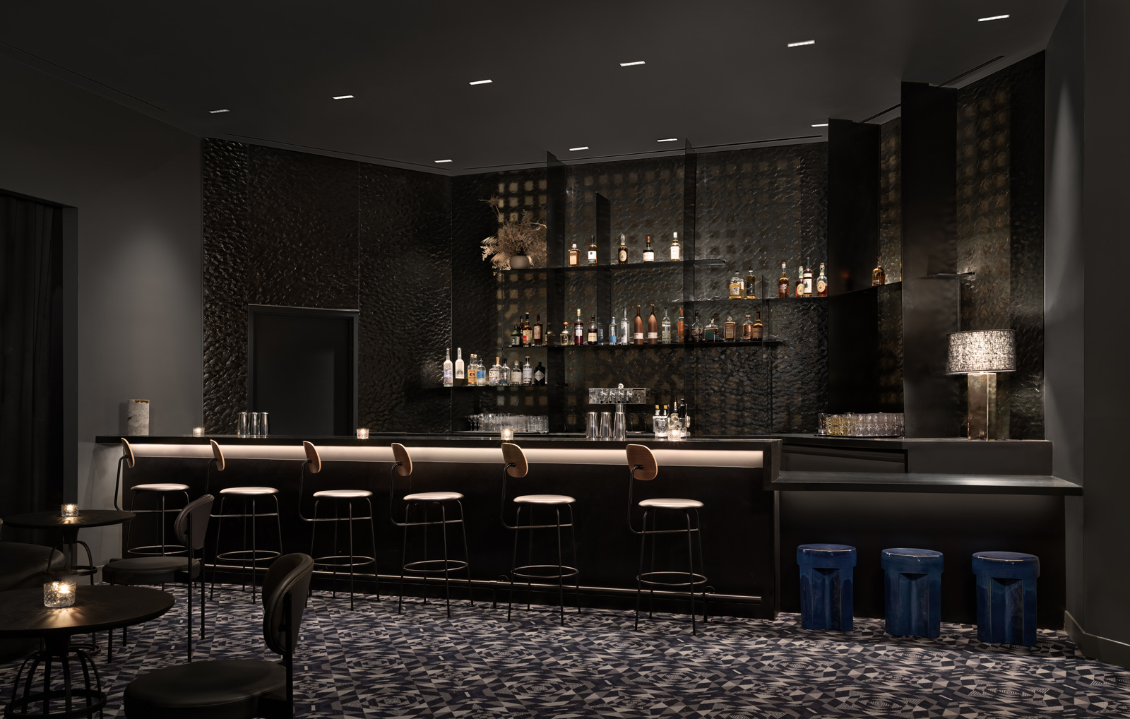 A dark grey cocktail bar